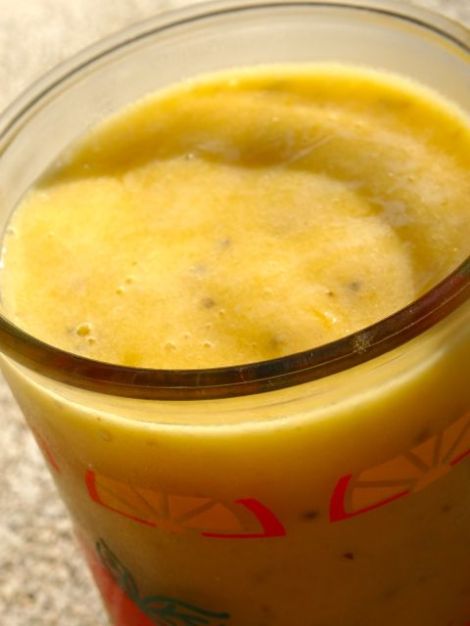 Yummy smoothie with mango, pineapple, frozen banana, chia & sunflower seeds.